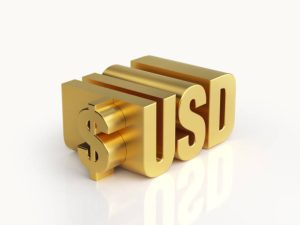 الدولار والذهب: علاقة عكسية تحكم توازن الأسواق العالمية